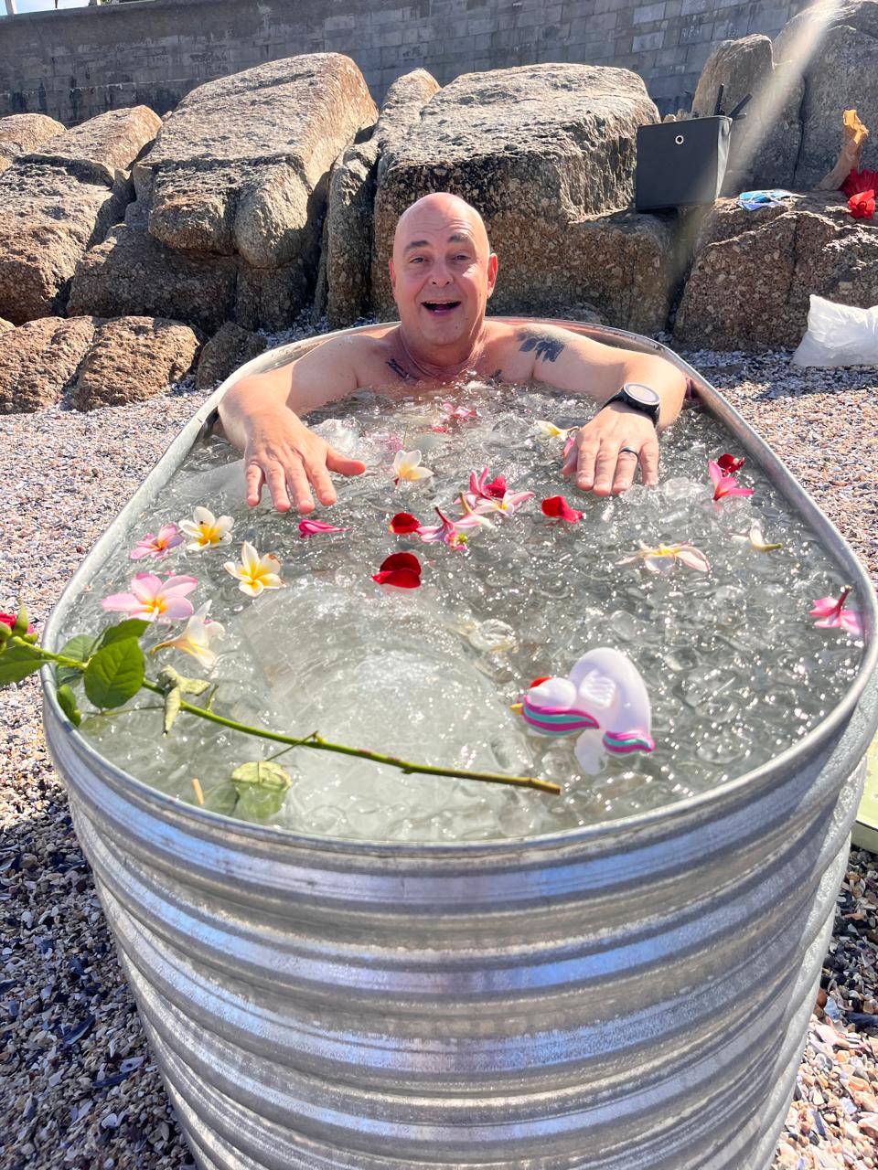 Ice bath with floating frangipani flowers